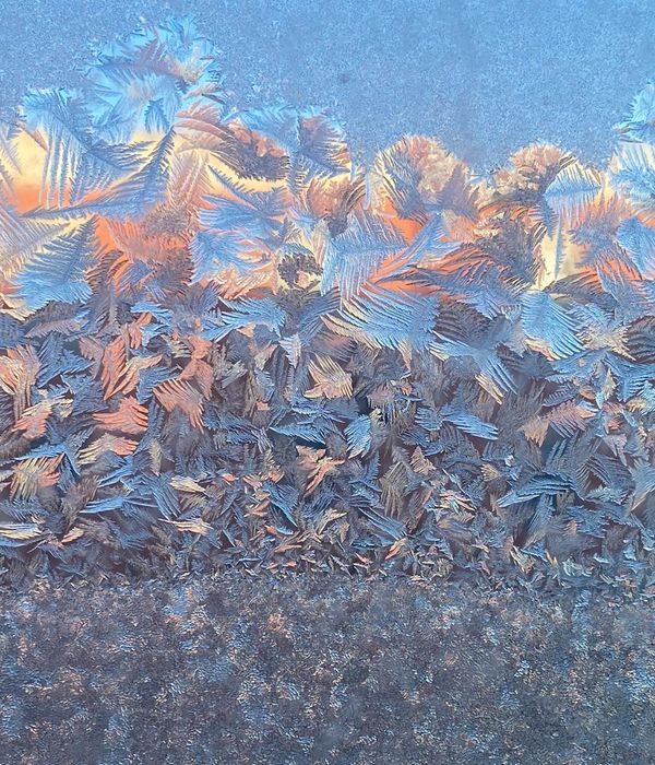 Abstract geometric ice structures reflecting soft morning light